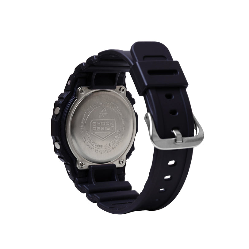 Black resin digital watch with metal caseback, black band with metal buckle, shown from rear view.