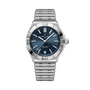 Stainless steel watch with dark blue dial, white hour markers, date window, and matching metal bracelet.
