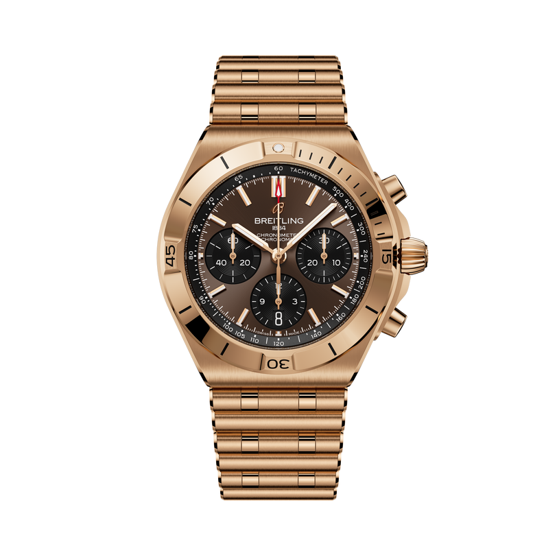 Gold-tone chronograph watch with black dial, three subdials, tachymeter bezel, and matching bracelet strap.