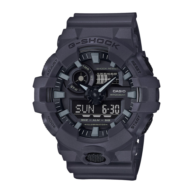 Gray G-Shock analog-digital watch with shock-resistant resin case, dual time display, and illuminated dial.