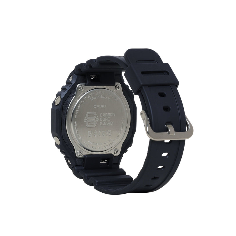 Black digital watch with square face, silver metal case back, and black resin band with metal buckle.