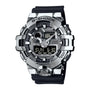 G-Shock digital watch with silver stainless steel case, black resin band, analog and digital display showing time and day.