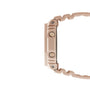 Pink resin digital watch with square face and textured band shown from the side.