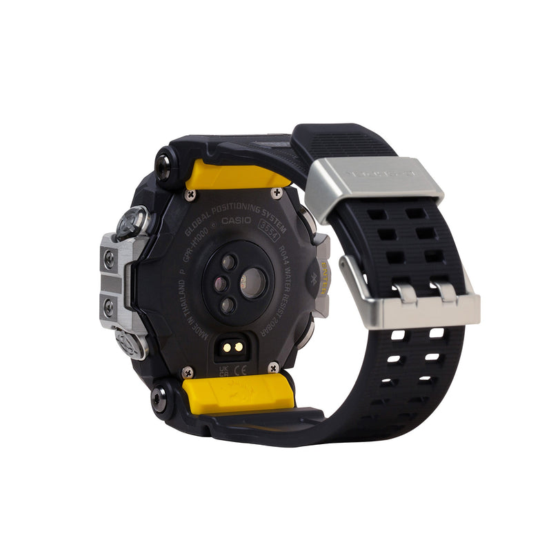 Black digital watch with yellow resin accents, silver case, and black band with square perforations.