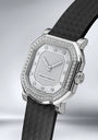 Gerald Charles watch with black strap and diamond-studded face on a light gray background