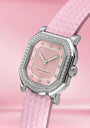 Pink watch with diamond accents on a pink background