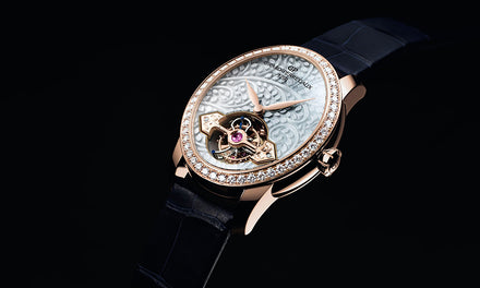 Girard-Perregaux Cat's Eye watch with a diamond bezel on a rose gold case and a leather strap