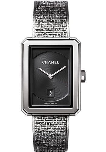 The Chanel Boy·Friend Tweed Medium Model is a rectangular wristwatch with a black guilloché dial, silver hands, date at 6 o’clock, and a textured silver strap. Its minimalist design features "Swiss Made" at the bottom.