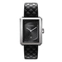 The Chanel Boy·Friend is a medium rectangular steel watch with a black quilted calfskin strap, black dial, silver hands, date display at 6 o’clock, and a sleek silver bezel.