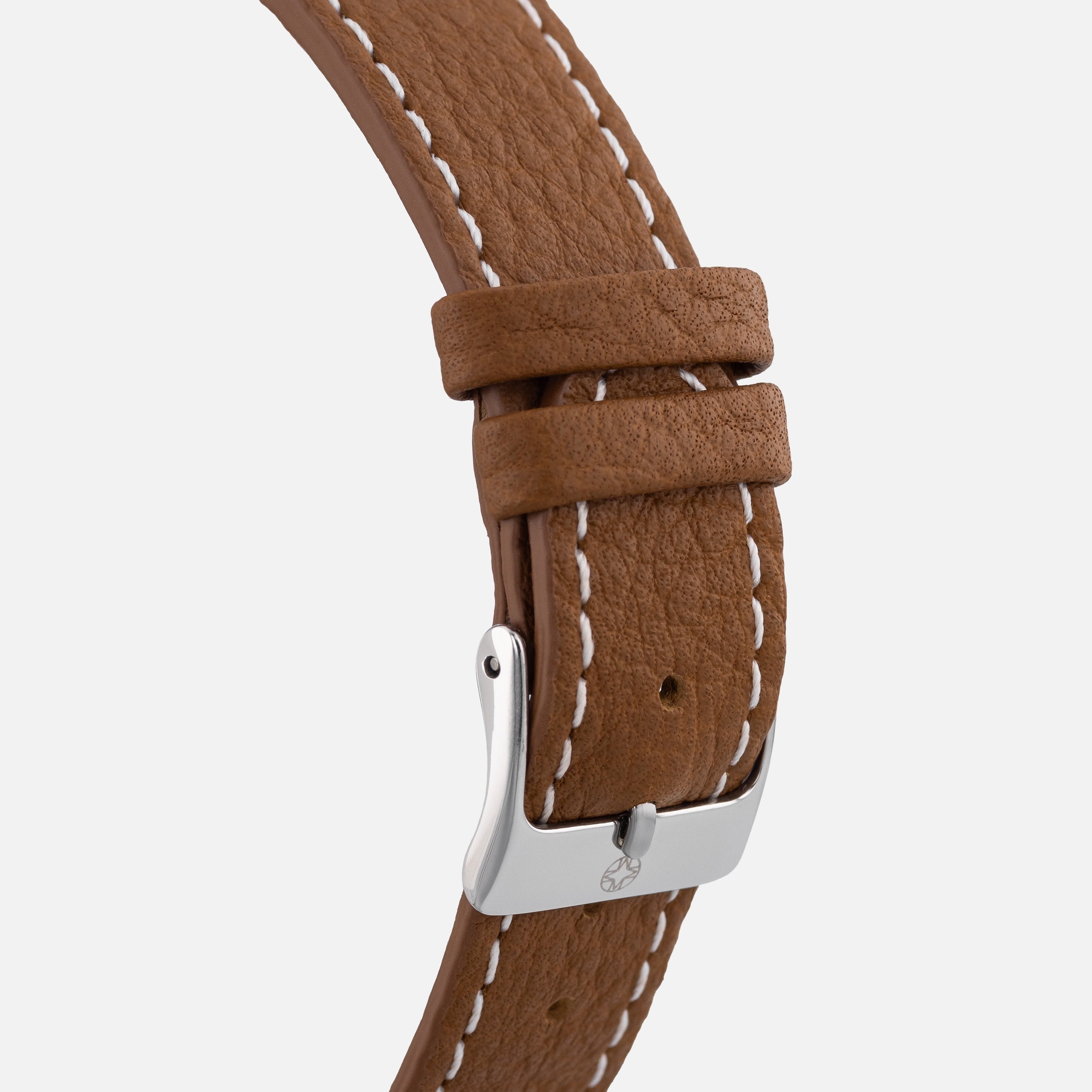 Close-up of the Merci INSTRUMENTS Beaumarchais H02 Limited Edition For Hodinkees brown leather strap with white stitching and a silver buckle.