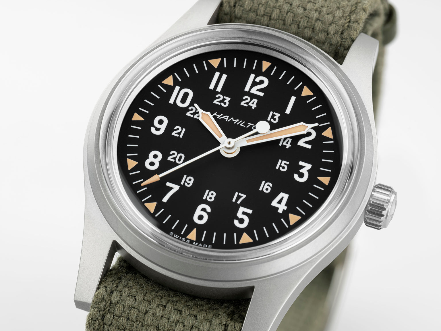 Hamilton watch with black dial and green strap on a white background