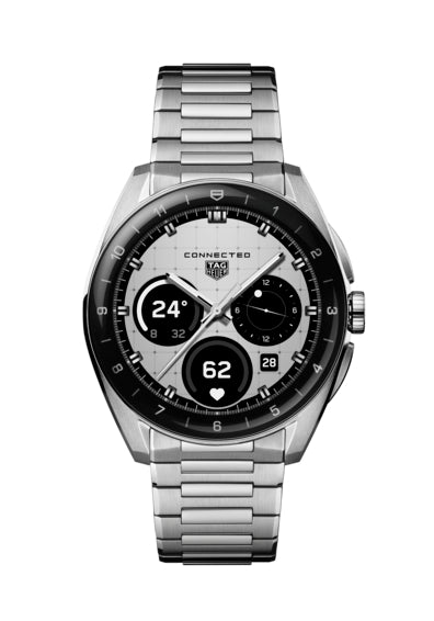 The TAG Heuer Connected Calibre E5 40mm is a silver luxury smartwatch with a metal band, black bezel, and digital display showing time, date, weather, and fitness stats on a white background.