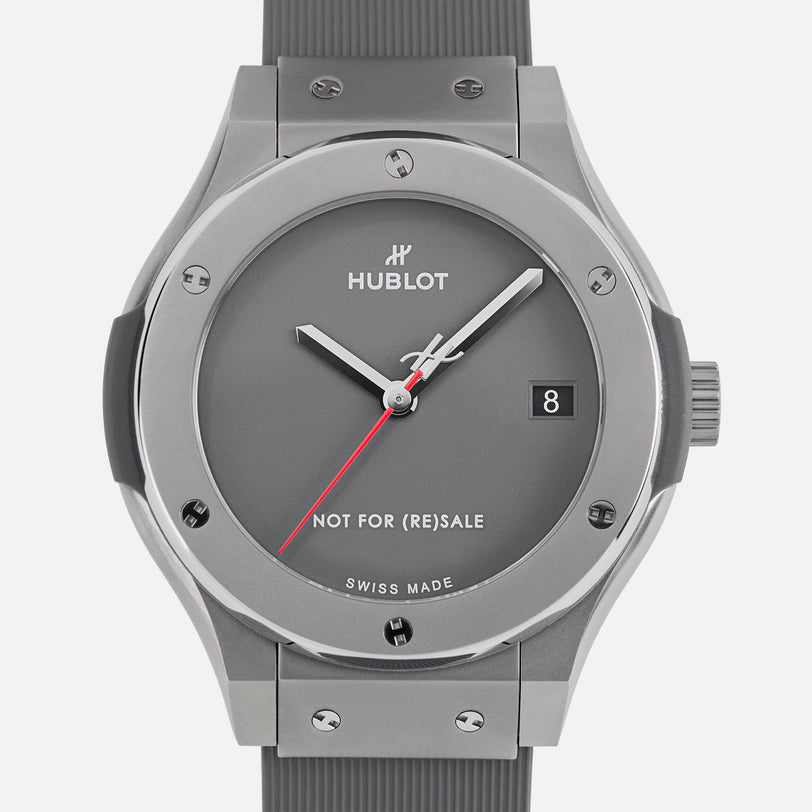 The Hublot Classic Fusion Titanium Limited Edition For Hodinkee features a gray dial, gray strap, silver bezel, red second hand, date display, and NOT FOR (RE)SALE above SWISS MADE—a special Hublot x Hodinkee collaboration.