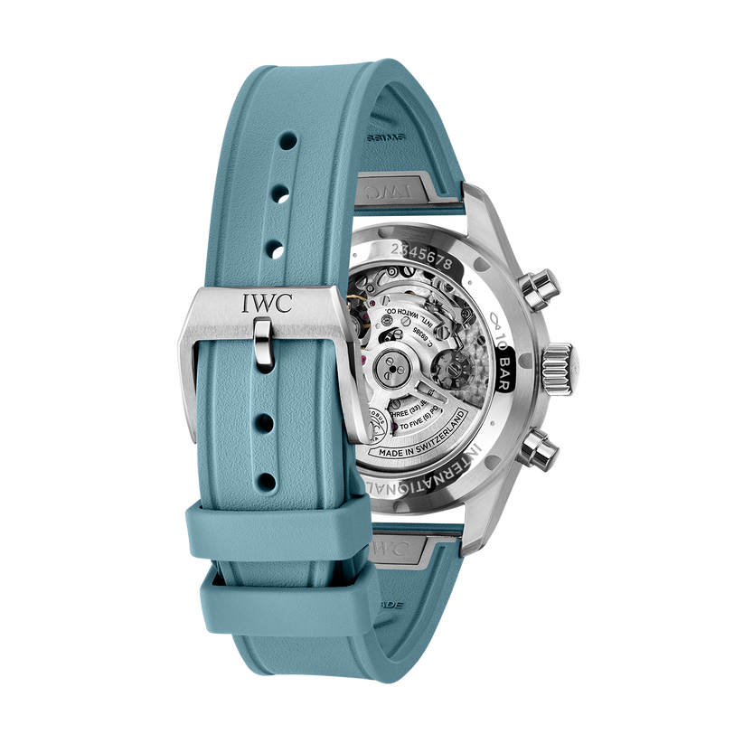 The IWC Schaffhausen Pilot Chronograph Miramar Edition is a luxury watch featuring a blue rubber strap and an exposed mechanical movement on the back.