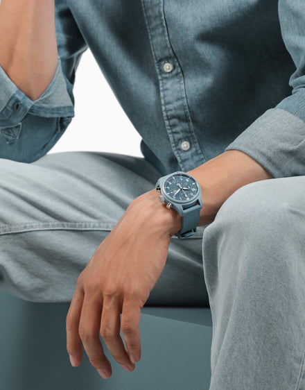 Man wearing blue IWC watch wearing blue outfit