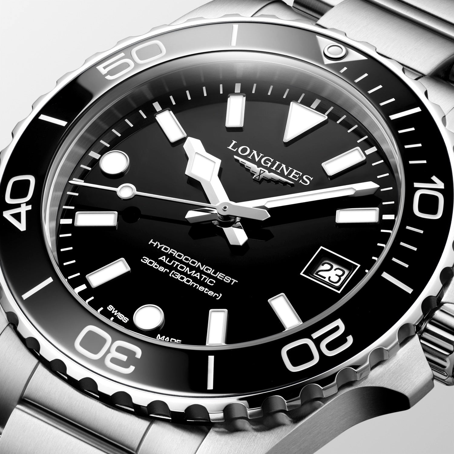 Longines watch with black dial and silver case on a white background