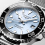 Longines watch with silver bezel and blue dial on a white background