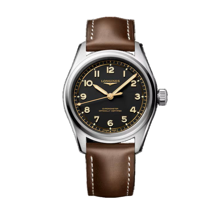 The Longines Spirit Pilot wristwatch features a black dial, gold numerals, brown leather strap with white stitching, and a stainless steel case—combining precision engineering and refined style.