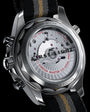 Stainless steel Seamaster Diver 300M chronograph watch with silver dial, red text, and black fabric strap with gold stripe.