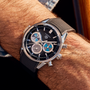 A TAG Heuer Carrera Chronograph Seafarer × Hodinkee watch from TAG Heuer with a black strap on a mans wrist.