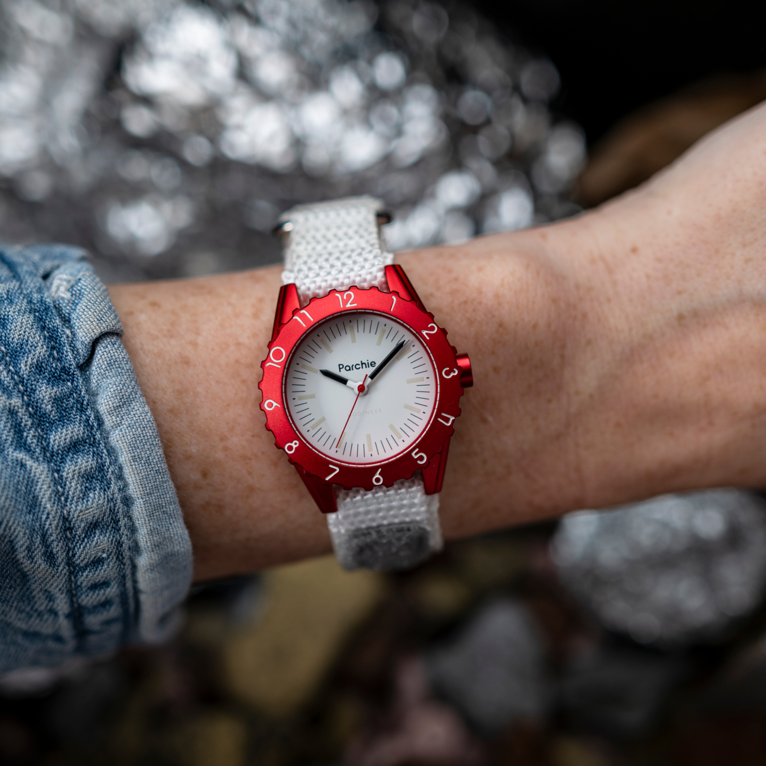 Parchie "Lunar-Time" Limited Editions for Hodinkee 32mm watch on female model's left wrist