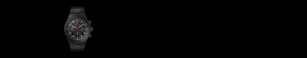 Black metal chronograph wristwatch with a dark face, displayed on a black background, left-aligned.