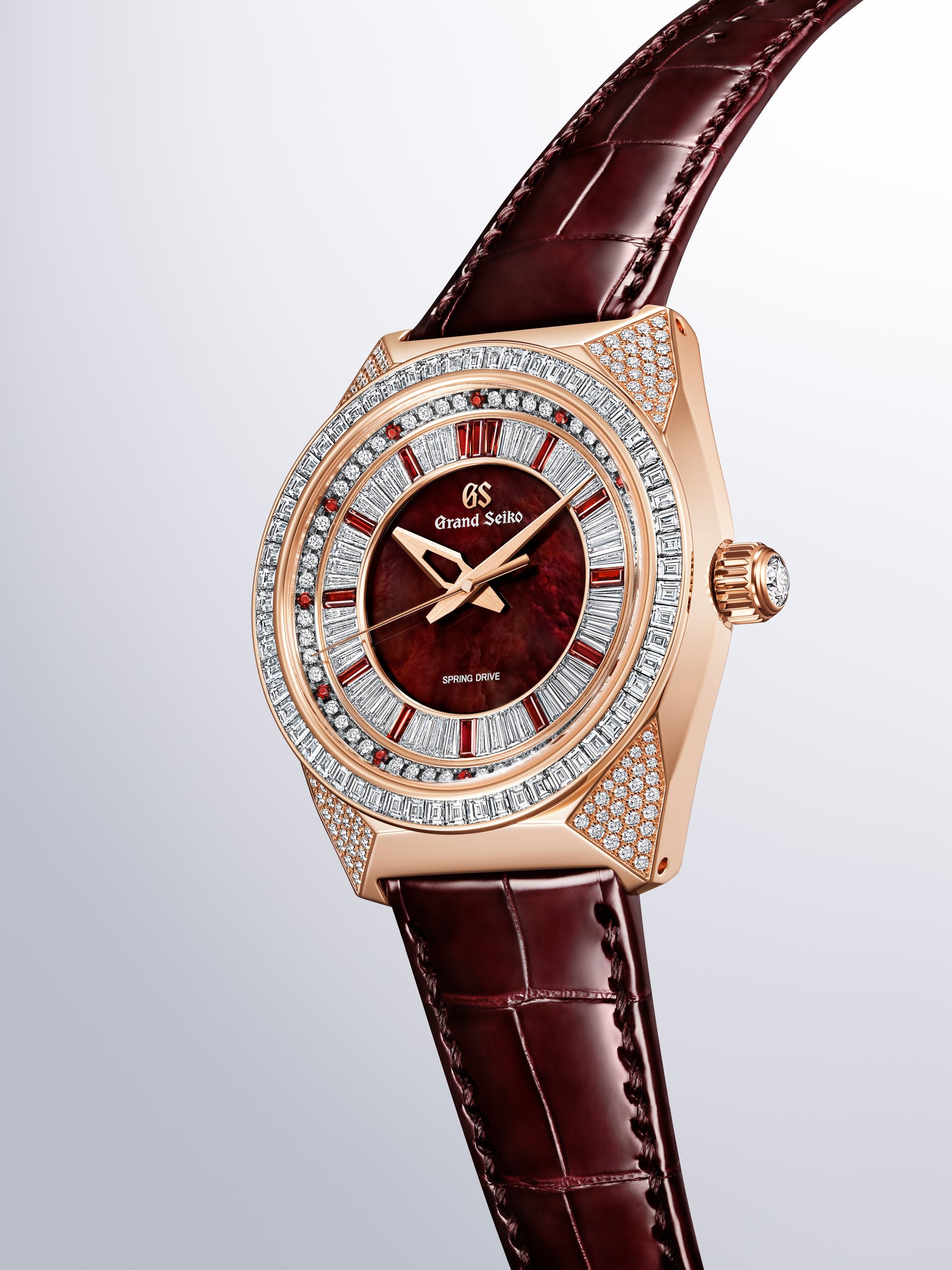 Grand Seiko SBGD228 rose gold watch with burgundy dial, diamond-set bezel, and matching leather strap.