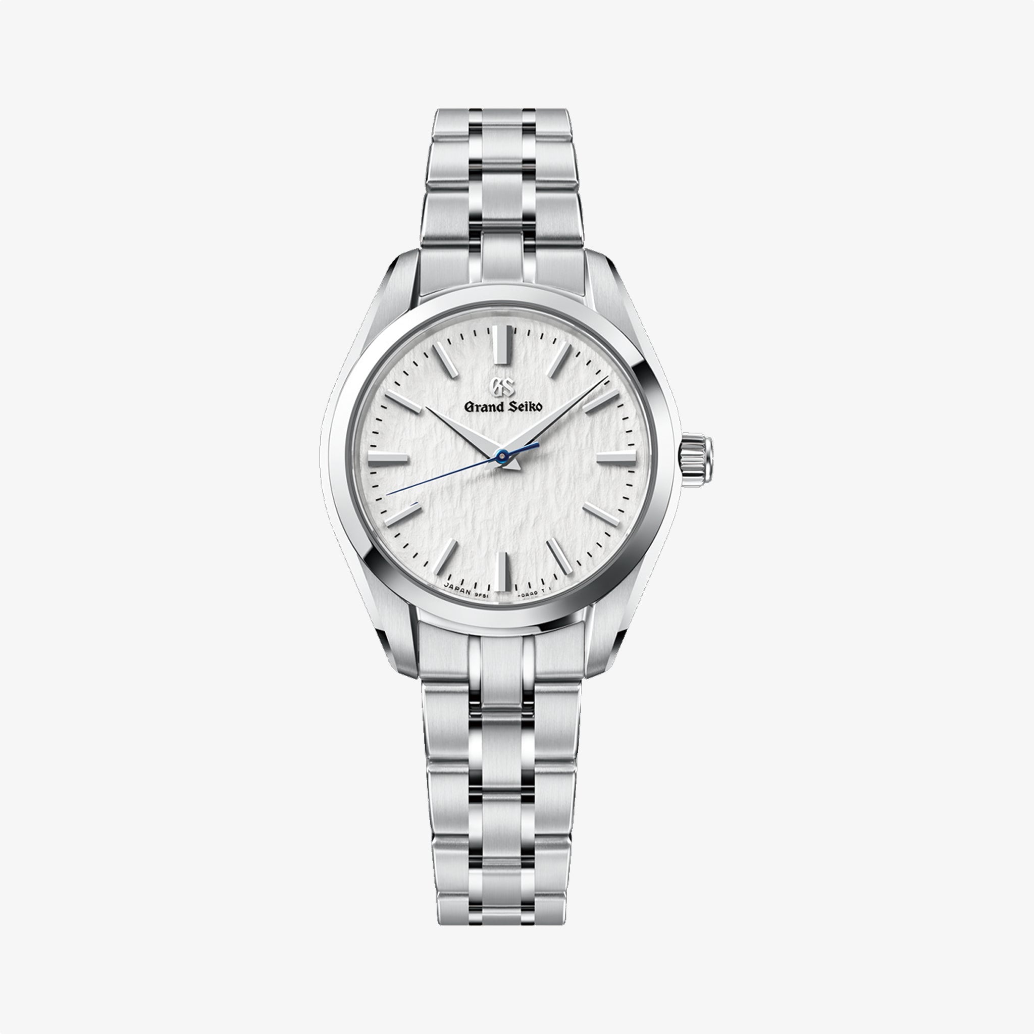 Silver watch with a white face on a light gray background