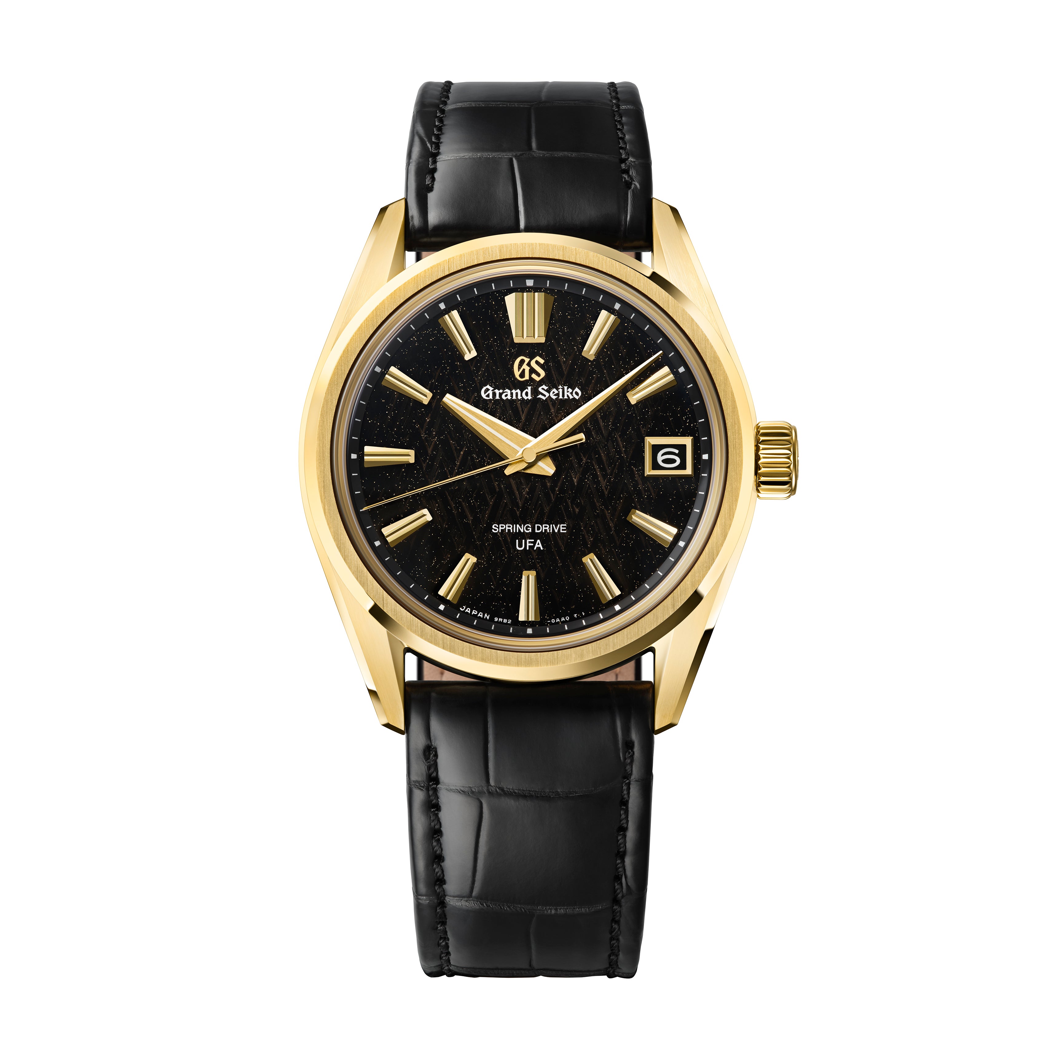 Gold-tone Grand Seiko watch with black dial, gold hour markers, date window, and black crocodile-textured leather strap.