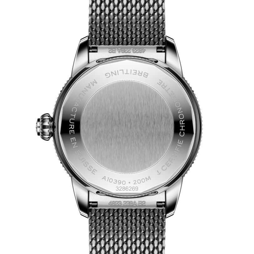 Back view of the Breitling Superocean Heritage Automatic 36, featuring a metal mesh strap and engraved case details against a black background.