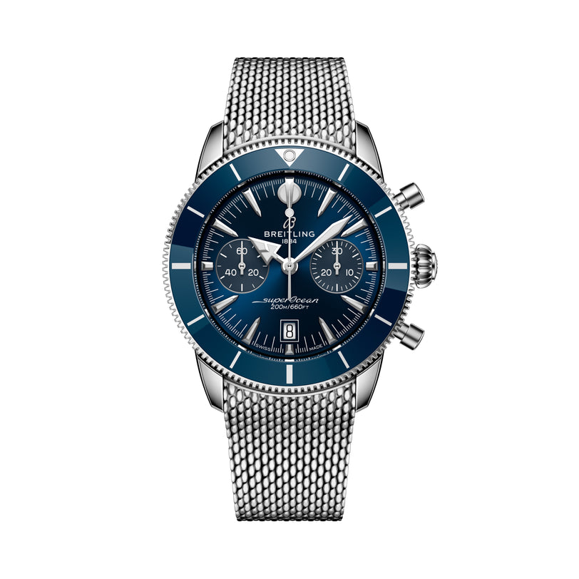 A Breitling Superocean Heritage B01 Chronograph 42 watch featuring a blue dial and silver mesh strap, displayed on a white background.
