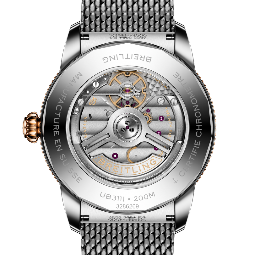 Back view of the Breitling Superocean Heritage B31 Automatic 42 reveals its exposed mechanical movement and detailed engravings on the metal case.