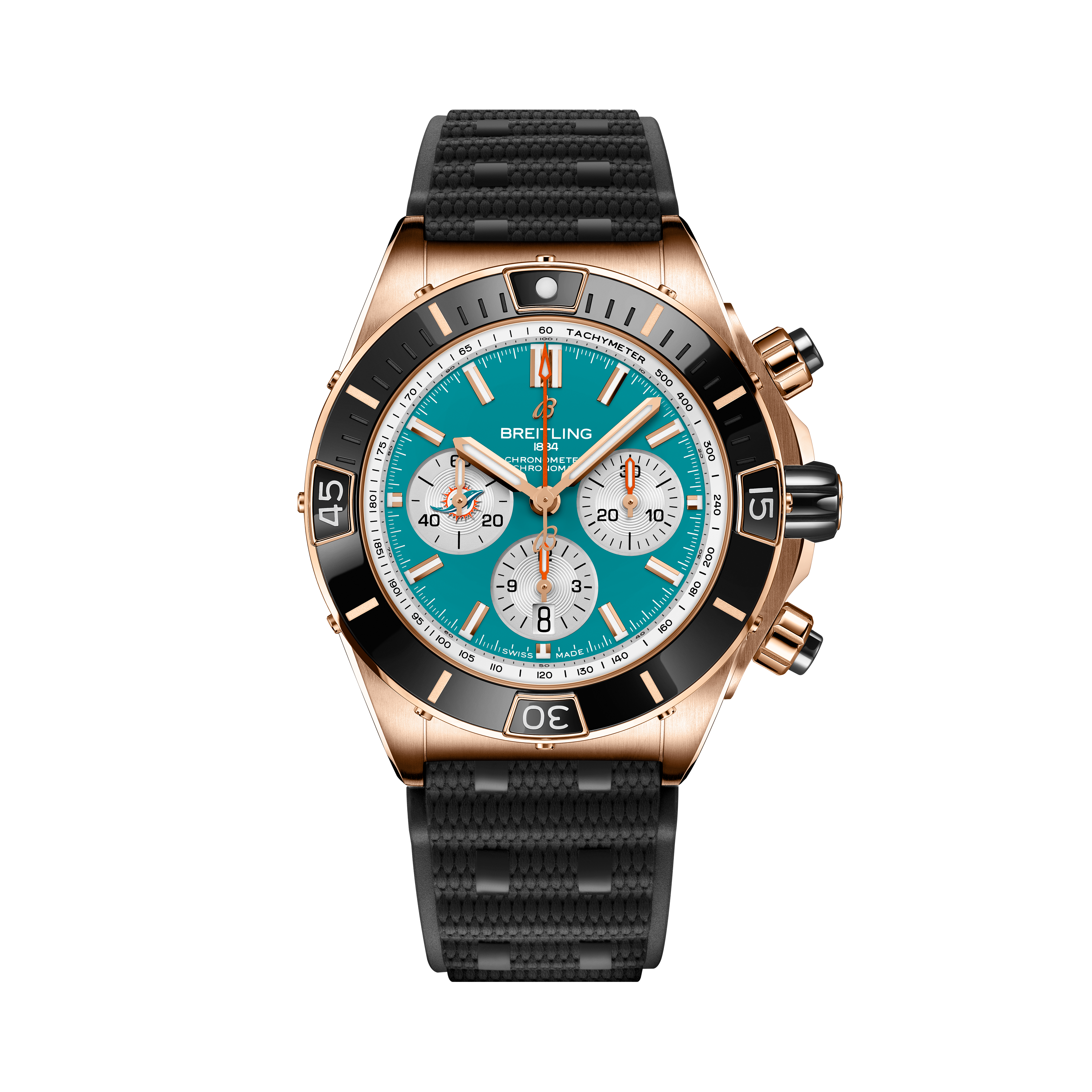The Breitling Super Chronomat B01 44 Miami Dolphins features a turquoise dial, rose gold case, black bezel, three subdials, and a black textured rubber strap, shown on a plain light background.