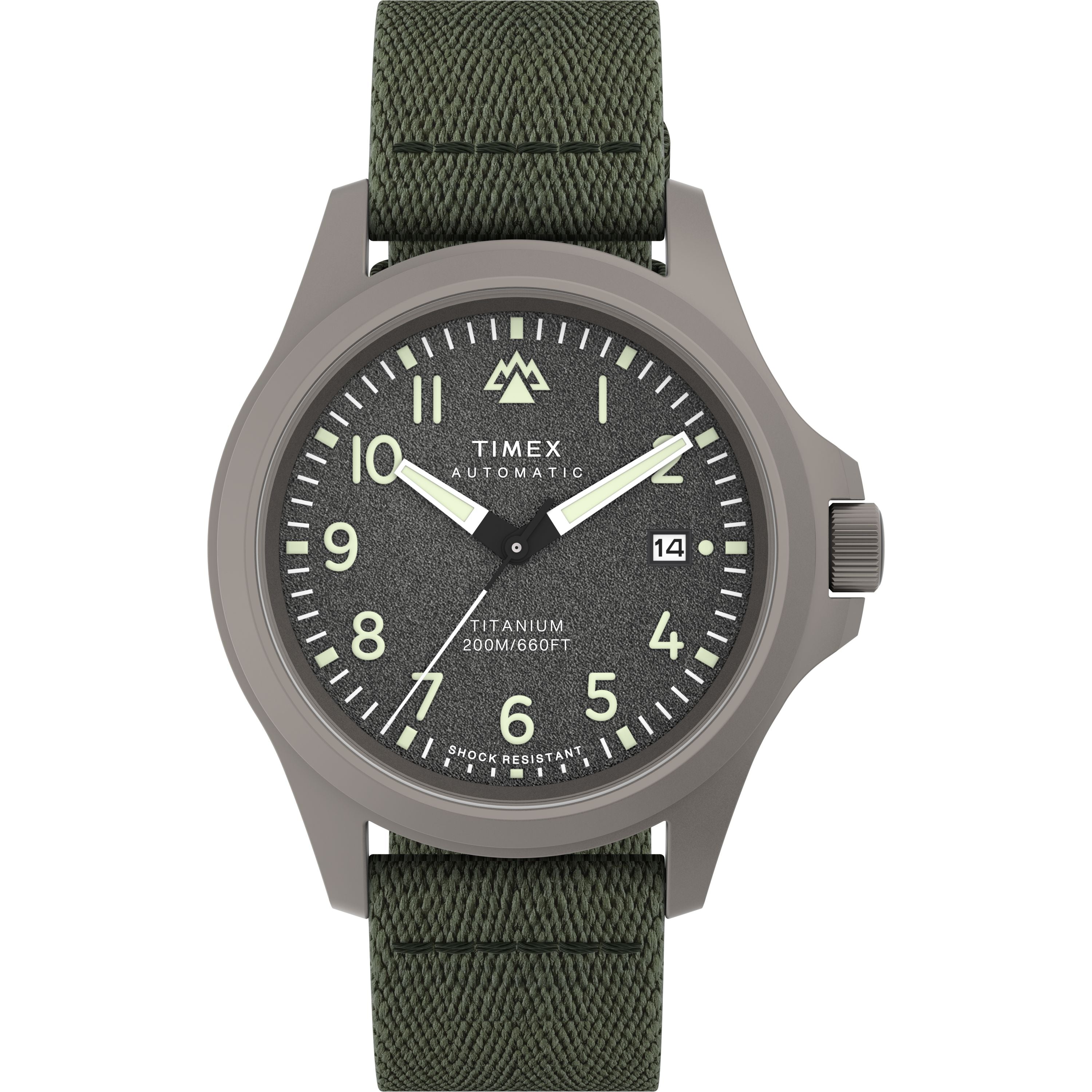 The Timex Expedition Titanium Automatic features a textured dark gray dial with white numerals and hands, date at 3 o’clock, titanium case (200M/660FT water-resistant, shock resistant), and a green fabric strap.