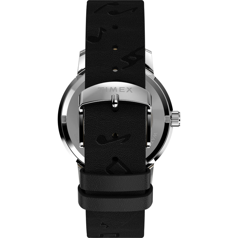 Back view of the Timex x Peanuts Marlin® Automatic Saxophonist wristwatch with a black leather strap, silver buckle engraved with TIMEX, visible stitching, and a stainless steel case for a classic look.