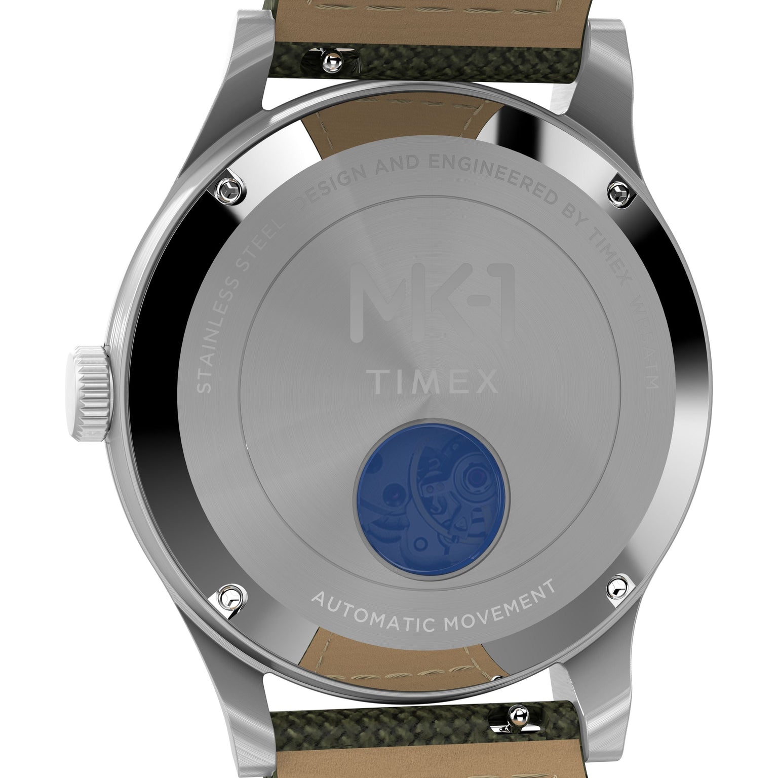 The Timex G SS AU SW MK1 40 BLK DL GRN STP 25 features a stainless steel case with engraved text, a blue-tinted window revealing the Japanese automatic movement, and green textile plus tan leather straps in a military style.