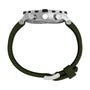 Side view of the Timex Expedition® Tide-Temp-Compass watch with a silver round case, black bezel, three side buttons, dark green strap, and silver buckle, shown against a white background.