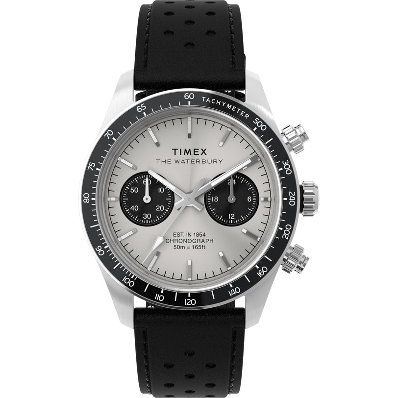 The Timex Waterbury Heritage Chronograph features a silver dial, black tachymeter bezel, black subdials, silver hour markers, and a black perforated leather strap. Water resistant to 50m (165ft).
