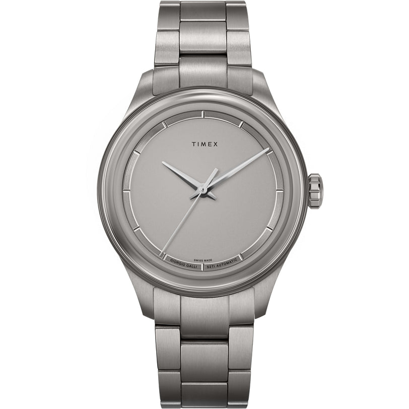 The Timex Giorgio Galli S2Ti Automatic is a stainless steel wristwatch with a silver metal band, minimalist grey dial, silver hands, simple hour markers, and a scratch-resistant sapphire crystal.