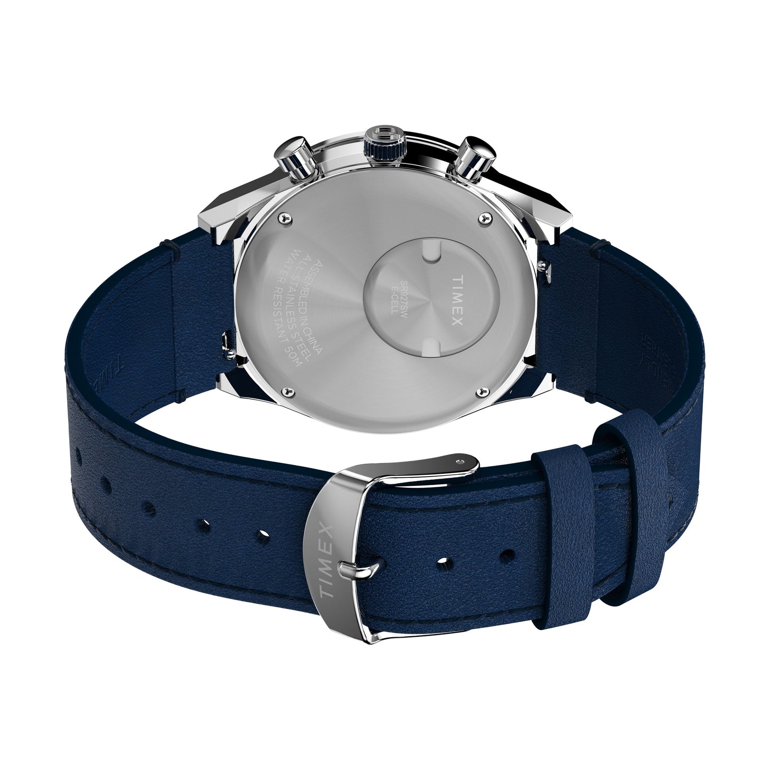 A close-up of the Q Chronograph by Timex shows its polished metal case, engraved branding, blue leather strap, and silver buckle.