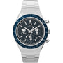 The Timex x Peanuts® Q Chronograph by Timex features a stainless-steel bracelet, blue bezel, dark blue dial with three subdials, chronograph movement, white markers, date window, and dual pushers.