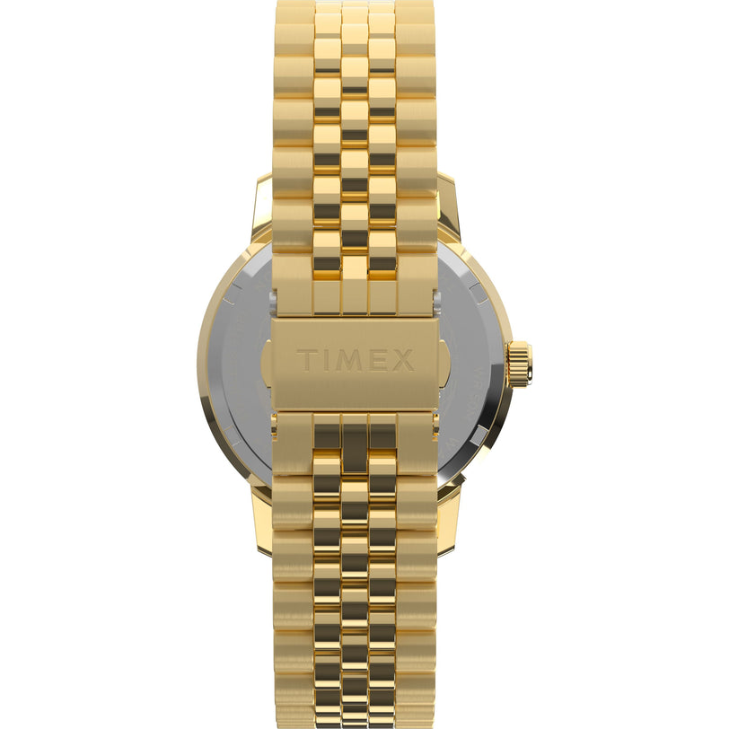 The Marlin® Quartz GMT by Timex is shown from the back, showcasing its stainless-steel bracelet and a clasp engraved with TIMEX, with parts of the watch case and crown also visible.