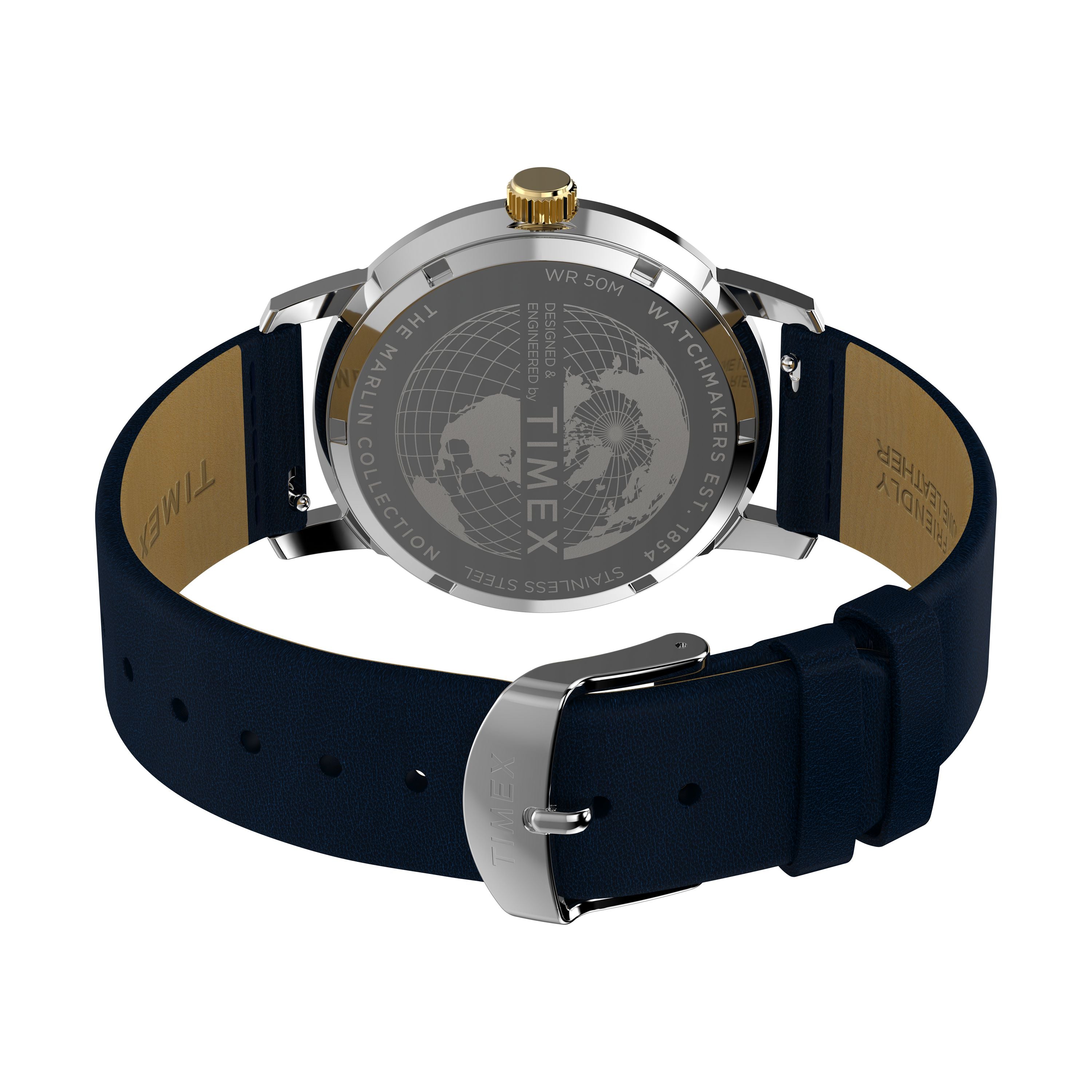 The Timex Marlin® Quartz GMT watch features a navy blue leather strap, gold-colored crown, and silver buckle. Its stainless steel case back is engraved with a world map, brand logo, and technical details. The watch offers dual time zone functionality.