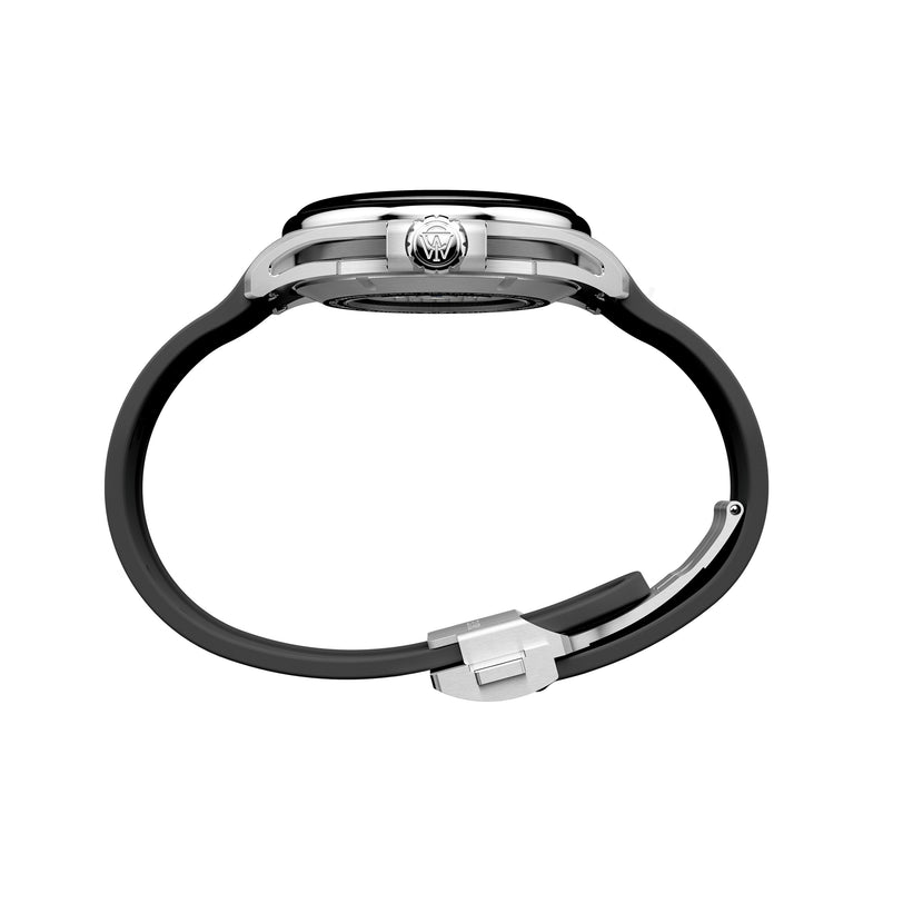 Side view of the Timex Atelier GMT24 M1a Swiss Made Automatic, featuring a black strap, silver case, visible crown, and open clasp, displayed against a white background.