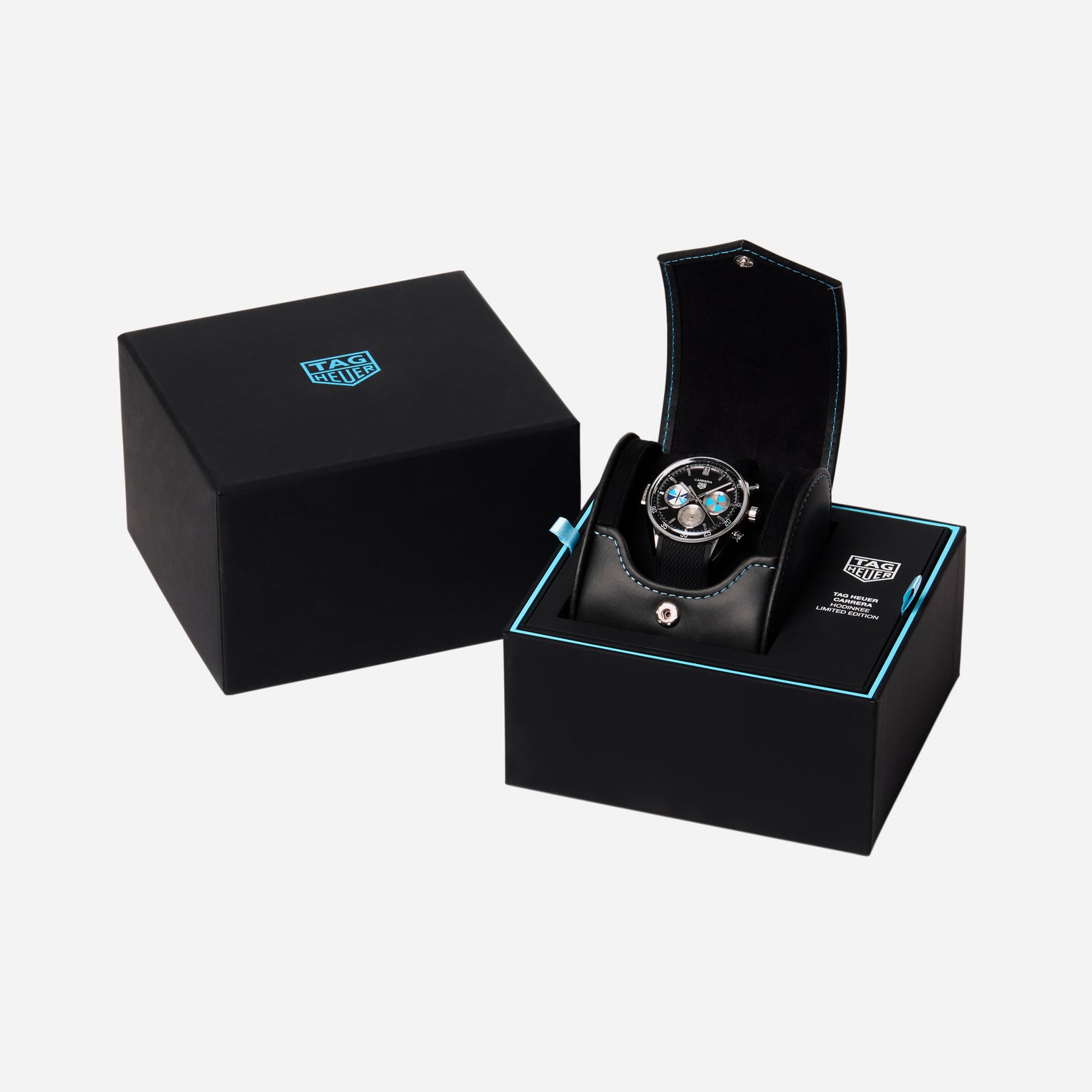 The TAG Heuer Carrera Chronograph Seafarer × Hodinkee is shown in an open black box, with a closed black box next to it, all set against a white background.