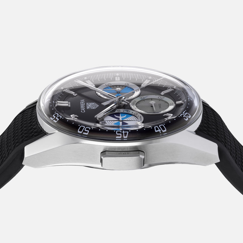 Side view of the TAG Heuer Carrera Chronograph Seafarer × Hodinkee watch featuring a black strap and a blue, gray, and black chronograph dial.