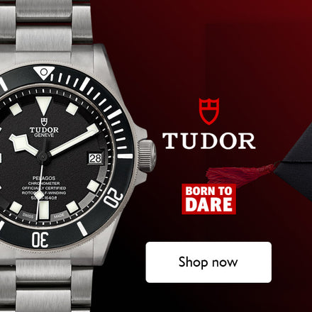 TUDOR Pelagos with black dial showcased on a red gradient background 