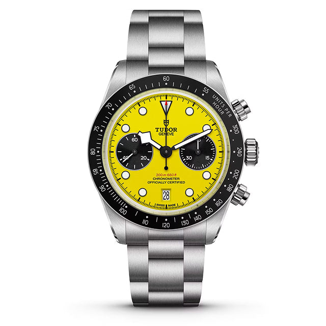 Stainless steel chronograph watch with yellow dial, black bezel, and three subdials.