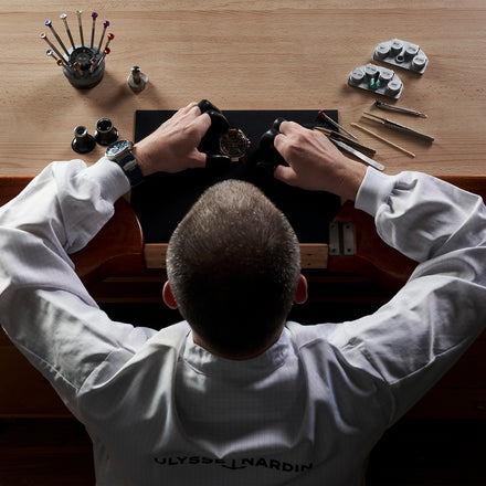 Ulysse Nardin watchmaker working on a watch