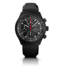 Black chronograph watch with tachymeter bezel, multiple subdials, day-date window, and red center hand on black leather strap